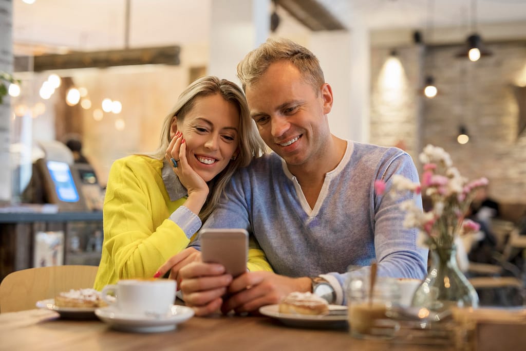 Couple looking at a smartphone together